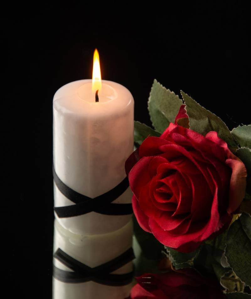 mourning candles and flowers