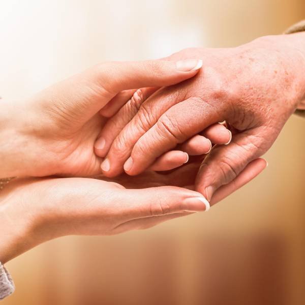 Holding hand in support